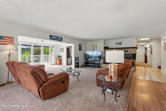 291 Comeback Bay Ln, Sagle, ID 83860 - living room with a textured ceiling and a fireplace