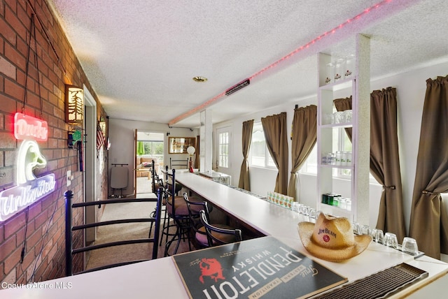 291 Comeback Bay Ln, Sagle, ID 83860 - kitchen with a textured ceiling and brick wall