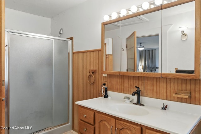 291 Comeback Bay Ln, Sagle, ID 83860 - full bath featuring a shower stall, vanity, wainscoting, and wooden walls