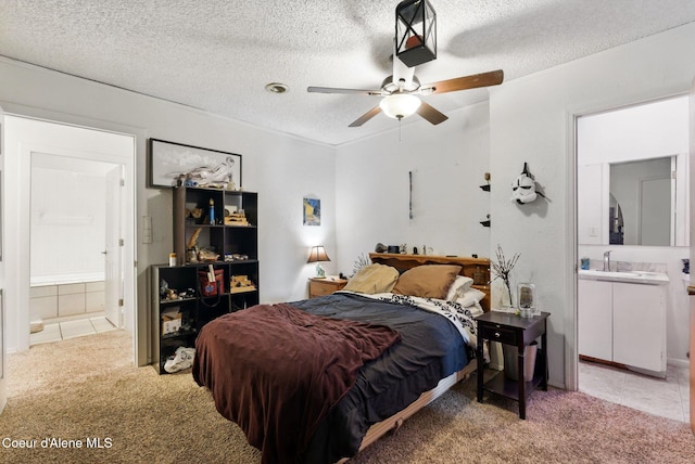 291 Comeback Bay Ln, Sagle, ID 83860 - bedroom featuring light colored carpet, a sink, ensuite bath, a textured ceiling, and ornamental molding