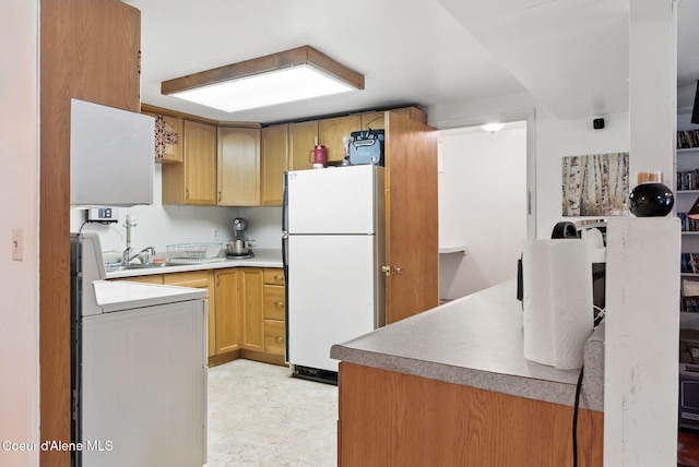 291 Comeback Bay Ln, Sagle, ID 83860 - kitchen with freestanding refrigerator, a sink, and light countertops