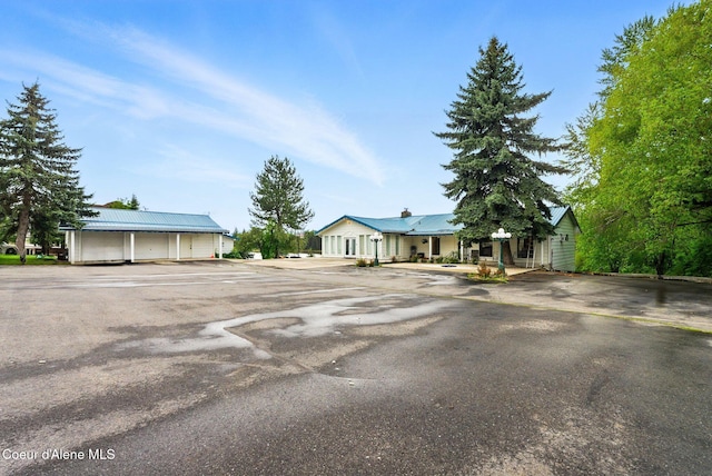 291 Comeback Bay Ln, Sagle, ID 83860 - view of front of home with metal roof and uncovered parking