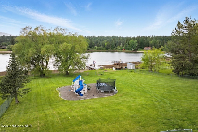 291 Comeback Bay Ln, Sagle, ID 83860 - view of grassy yard with a trampoline, a water view, a playground, and a forest view