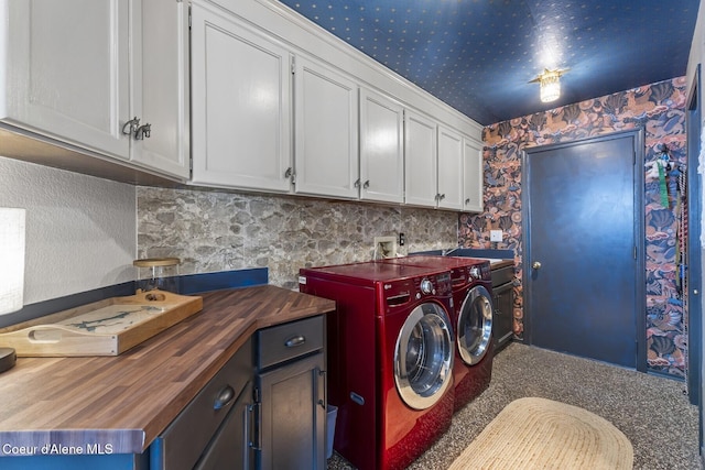 7104 W Kidd Island Rd, Coeur Dalene, ID 83814 - laundry room featuring cabinet space, wallpapered walls, separate washer and dryer, and carpet flooring