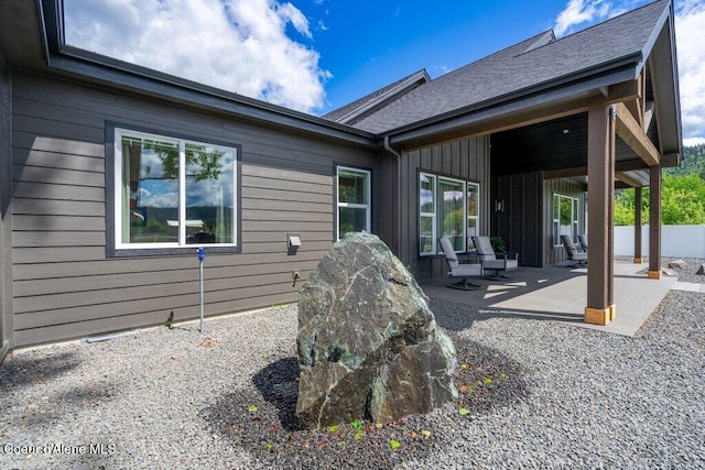 1831 E Dalton Ave, Dalton Gardens, ID 83815 - rear view of property featuring a patio and roof with shingles