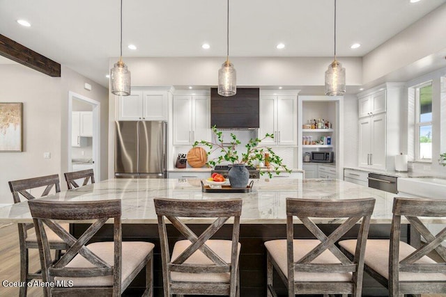 1831 E Dalton Ave, Dalton Gardens, ID 83815 - kitchen featuring appliances with stainless steel finishes, recessed lighting, white cabinetry, a warming drawer, and hanging light fixtures