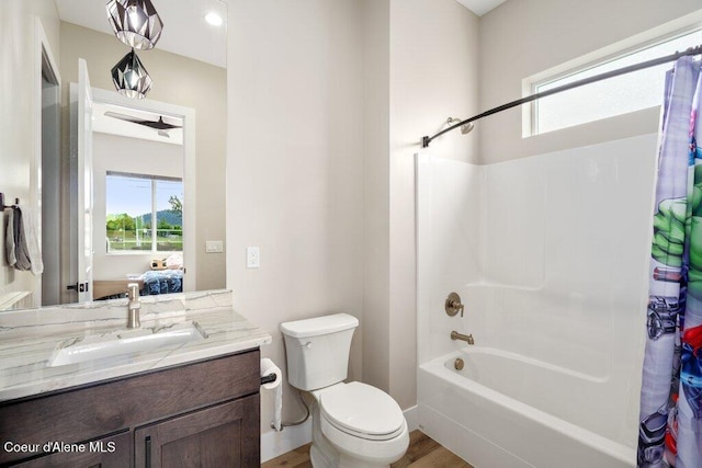 1831 E Dalton Ave, Dalton Gardens, ID 83815 - full bathroom featuring plenty of natural light, vanity, toilet, and shower / bath combo