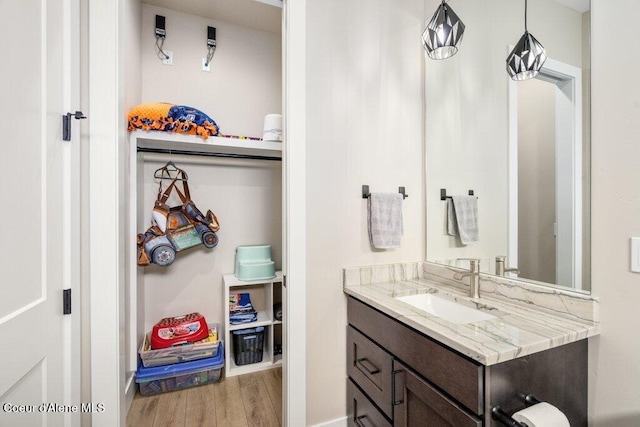 1831 E Dalton Ave, Dalton Gardens, ID 83815 - bathroom with vanity and wood finished floors