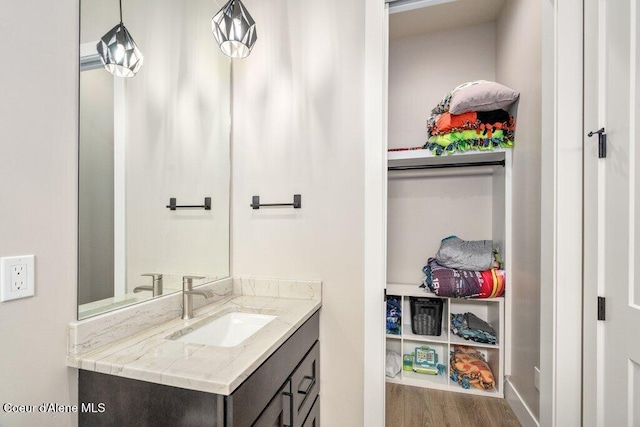 1831 E Dalton Ave, Dalton Gardens, ID 83815 - bathroom with vanity and wood finished floors