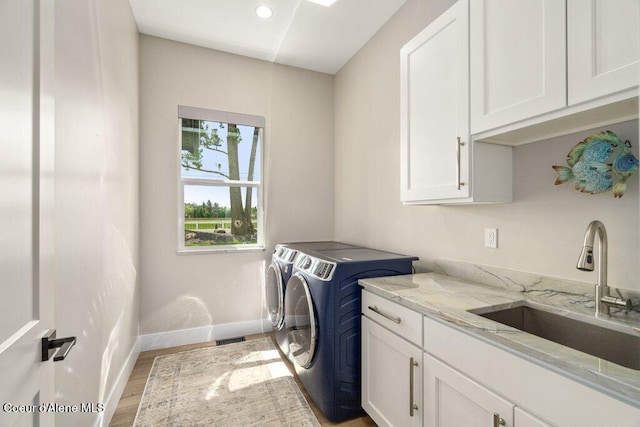 1831 E Dalton Ave, Dalton Gardens, ID 83815 - washroom featuring cabinet space, washing machine and clothes dryer, baseboards, light wood-style flooring, and recessed lighting