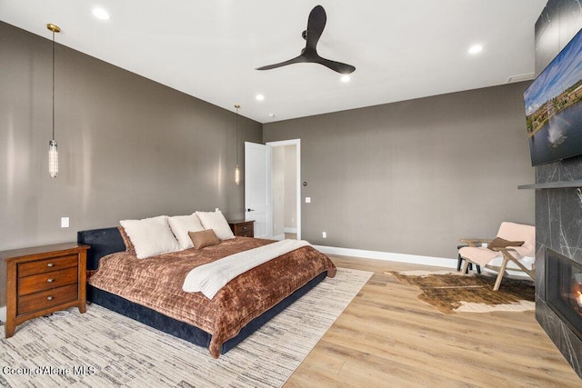 1831 E Dalton Ave, Dalton Gardens, ID 83815 - bedroom featuring a fireplace, light wood-style floors, baseboards, recessed lighting, and a ceiling fan
