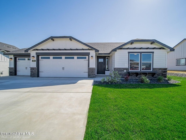 13659 N Apex Way, Hayden, ID 83835 - view of front of home featuring stone siding, a garage, and a front lawn