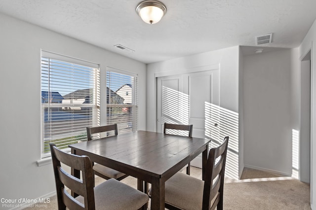13659 N Apex Way, Hayden, ID 83835 - dining room with baseboards and carpet flooring
