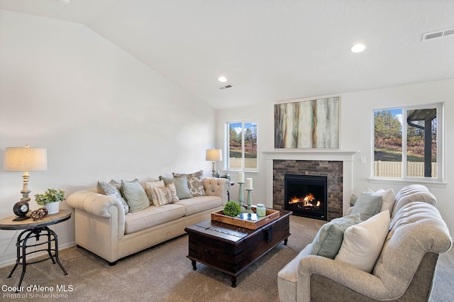 13659 N Apex Way, Hayden, ID 83835 - living area featuring lofted ceiling, carpet, a glass covered fireplace, and recessed lighting