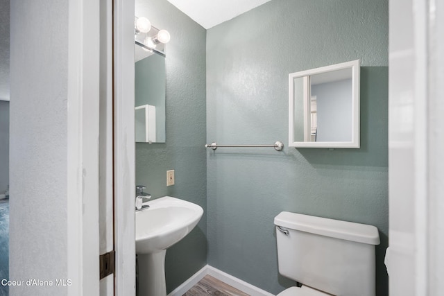 64 Winterbrook Way Unit 101, Sandpoint, ID 83864 - bathroom with wood finished floors and toilet