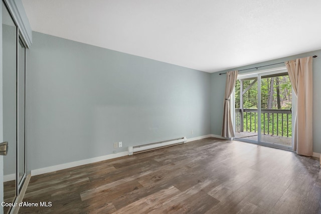 64 Winterbrook Way Unit 101, Sandpoint, ID 83864 - spare room featuring a baseboard radiator, wood finished floors, and baseboards