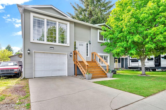 3277 N 10th Pl, Coeur Dalene, ID 83815 - bi-level home featuring a garage, driveway, and a front lawn