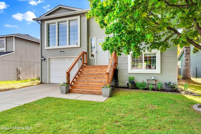 3277 N 10th Pl, Coeur Dalene, ID 83815 - traditional home featuring an attached garage, driveway, and a front lawn