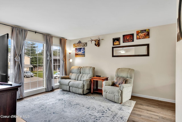 3277 N 10th Pl, Coeur Dalene, ID 83815 - living room with wood finished floors, baseboards, and ceiling fan