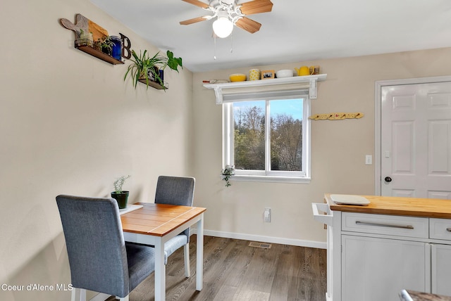 3277 N 10th Pl, Coeur Dalene, ID 83815 - dining space with wood finished floors, ceiling fan, and baseboards
