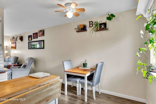 3277 N 10th Pl, Coeur Dalene, ID 83815 - dining space with a ceiling fan, wood finished floors, and baseboards