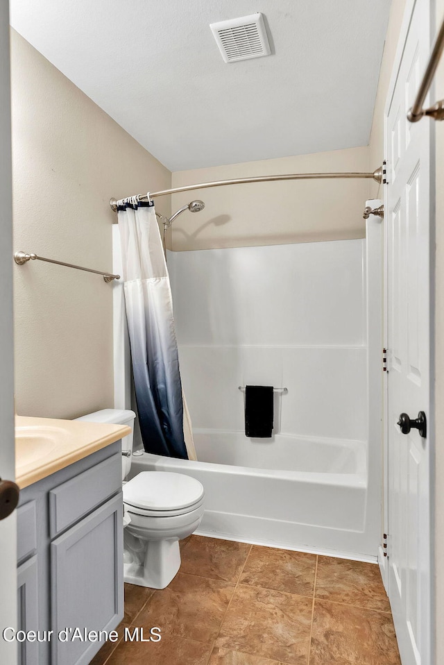 3277 N 10th Pl, Coeur Dalene, ID 83815 - bathroom with shower / bath combo with shower curtain, toilet, vanity, and tile patterned floors