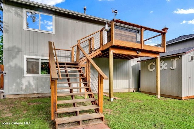 3277 N 10th Pl, Coeur Dalene, ID 83815 - rear view of house featuring stairs, a wooden deck, and a yard