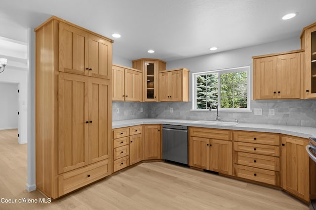 2411 W Diamond Bar Rd, Rathdrum, ID 83858 - kitchen with stainless steel dishwasher, light wood finished floors, light countertops, decorative backsplash, and recessed lighting