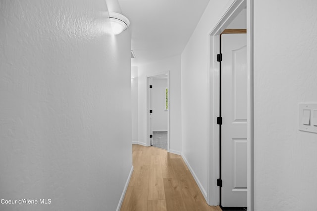 2411 W Diamond Bar Rd, Rathdrum, ID 83858 - hall with light wood-type flooring and baseboards