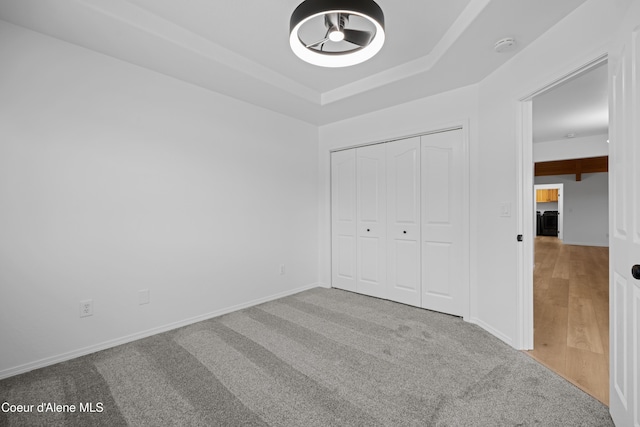 2411 W Diamond Bar Rd, Rathdrum, ID 83858 - unfurnished bedroom with carpet flooring, a raised ceiling, and a closet