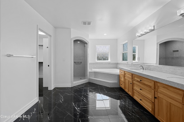 2411 W Diamond Bar Rd, Rathdrum, ID 83858 - bathroom featuring a shower stall, a garden tub, double vanity, a spacious closet, and marble tiled floors