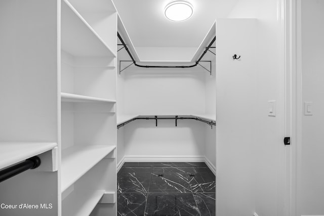 2411 W Diamond Bar Rd, Rathdrum, ID 83858 - walk in closet featuring marble look tiles