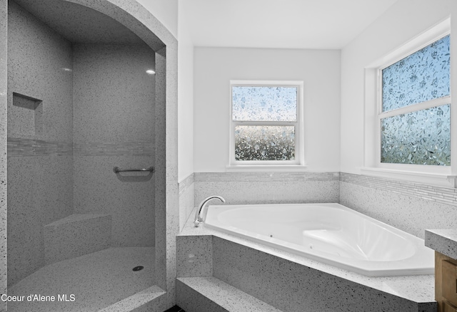 2411 W Diamond Bar Rd, Rathdrum, ID 83858 - bathroom featuring a tub with jets and wainscoting