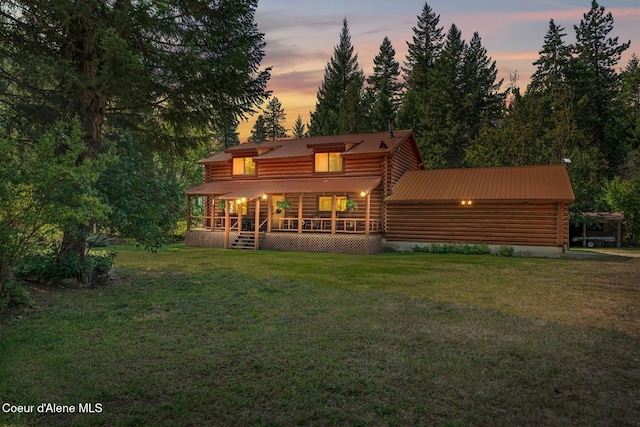 1180 Mountain View Rd, Clark Fork, ID 83811 - rear view of property with log siding, a lawn, and metal roof