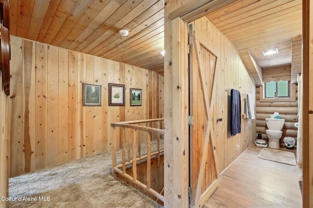1180 Mountain View Rd, Clark Fork, ID 83811 - corridor featuring wood ceiling, wooden walls, wood finished floors, and log walls