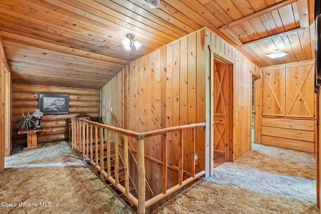1180 Mountain View Rd, Clark Fork, ID 83811 - hall with wood ceiling, carpet, log walls, and an upstairs landing