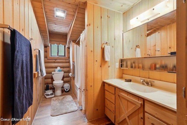1180 Mountain View Rd, Clark Fork, ID 83811 - full bathroom featuring toilet, hardwood / wood-style floors, rustic walls, vanity, and wood ceiling