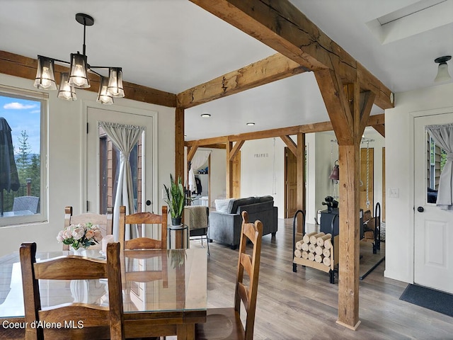 1155 Gold Creek Ridge Rd, Sandpoint, ID 83864 - dining space with a chandelier and wood finished floors