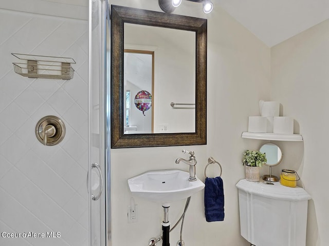 1155 Gold Creek Ridge Rd, Sandpoint, ID 83864 - full bathroom with a shower with door, a sink, and toilet