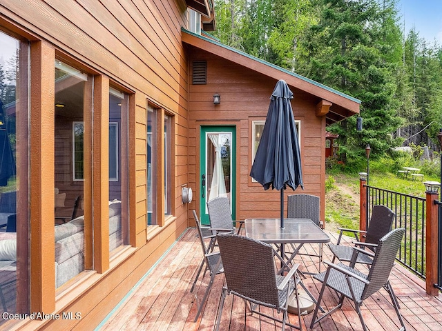1155 Gold Creek Ridge Rd, Sandpoint, ID 83864 - wooden terrace featuring outdoor dining area