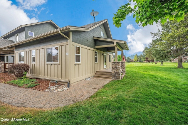 49-C Chardonnay Dr, Blanchard, ID 83804 - view of side of home featuring board and batten siding and a yard