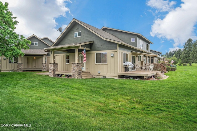 49-C Chardonnay Dr, Blanchard, ID 83804 - back of house with board and batten siding, a lawn, and a deck