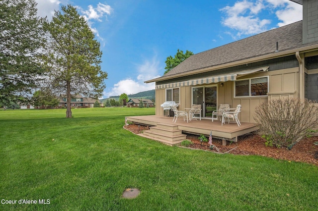 49-C Chardonnay Dr, Blanchard, ID 83804 - view of green lawn with a deck