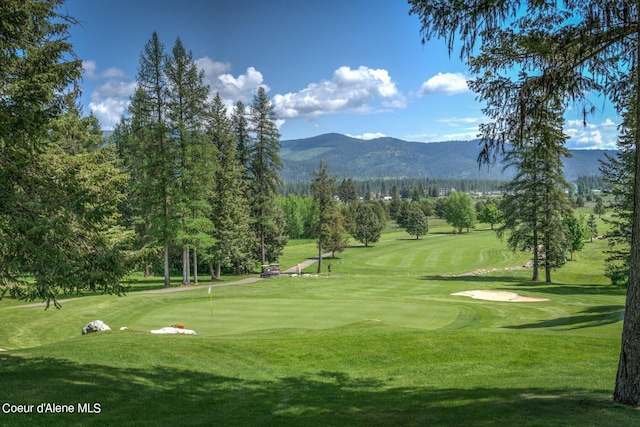 49-C Chardonnay Dr, Blanchard, ID 83804 - view of community featuring a mountain view, view of golf course, a yard, and a putting green
