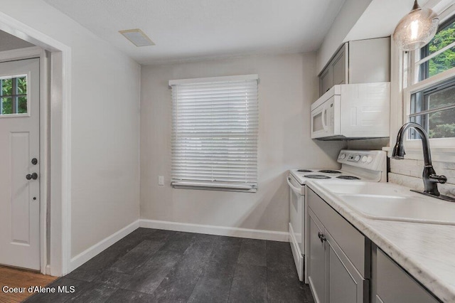 1415 N 2nd St, Coeur Dalene, ID 83814 - laundry area with plenty of natural light and baseboards