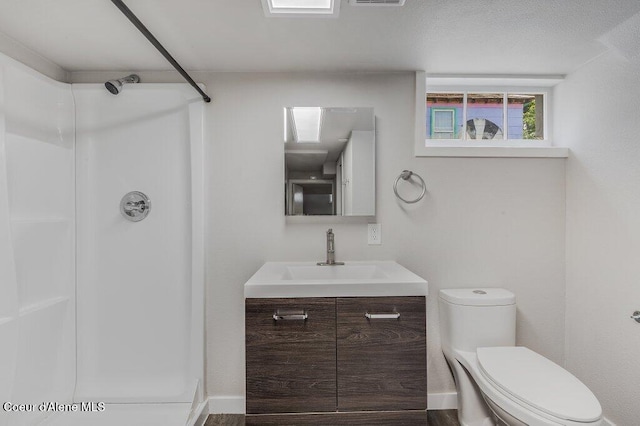 1415 N 2nd St, Coeur Dalene, ID 83814 - full bath with a shower, vanity, and toilet