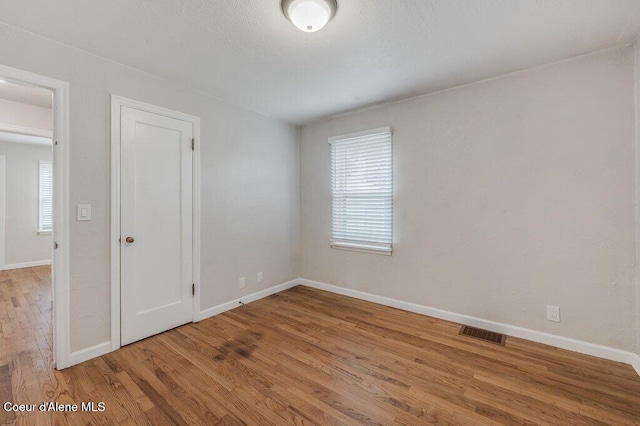 1415 N 2nd St, Coeur Dalene, ID 83814 - spare room featuring wood finished floors and baseboards