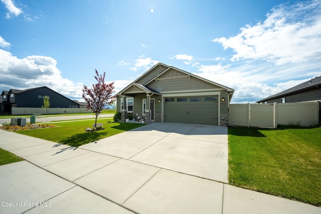 13311 N Loveland Way, Hayden, ID 83835 - craftsman-style house featuring stone siding, a garage, and concrete driveway