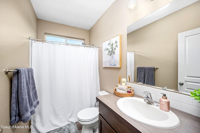 13311 N Loveland Way, Hayden, ID 83835 - bathroom with vanity, toilet, and a shower with shower curtain