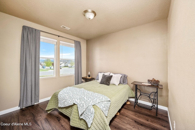 13311 N Loveland Way, Hayden, ID 83835 - bedroom featuring wood finished floors and baseboards